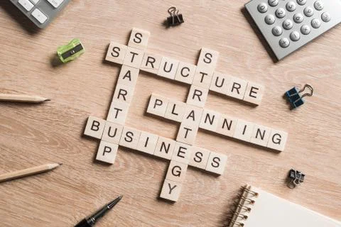Conceptual business keywords on table with elements of game making crossword Stock Photos