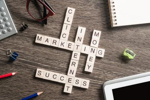 Conceptual business keywords on table with elements of game making crossword Stockfoto's