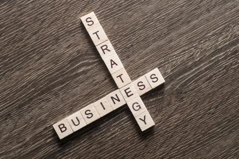 Conceptual business keywords on table with elements of game making crossword 写真素材