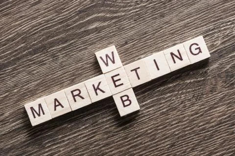 Conceptual business keywords on table with elements of game making crossword Stockfoto's