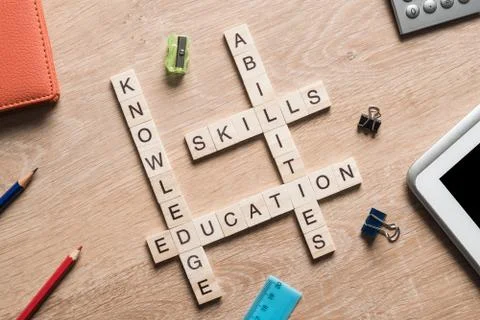 Conceptual business keywords on table with elements of game making crossword Foto stock