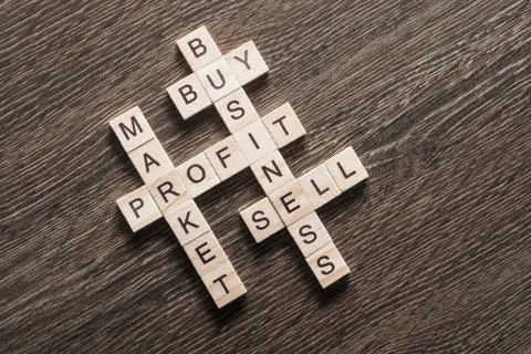 Conceptual business keywords on table with elements of game making crossword Stockfoto's