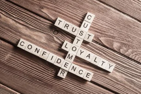 Conceptual business keywords on table with elements of game making crossword Foto stock