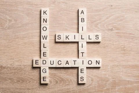Conceptual business keywords on table with elements of game making crossword Foto stock