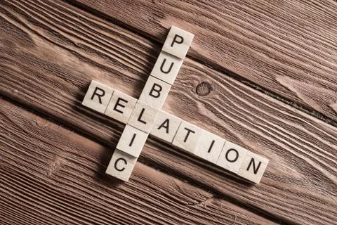 Conceptual business keywords on table with elements of game making crossword Stockfoto's