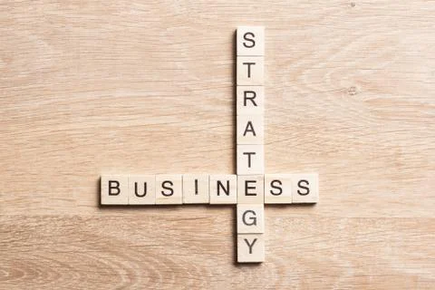 Conceptual business keywords on table with elements of game making crossword Stock Photos