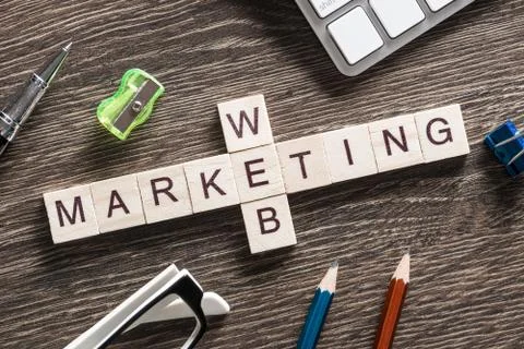 Conceptual business keywords on table with elements of game making crossword Foto stock