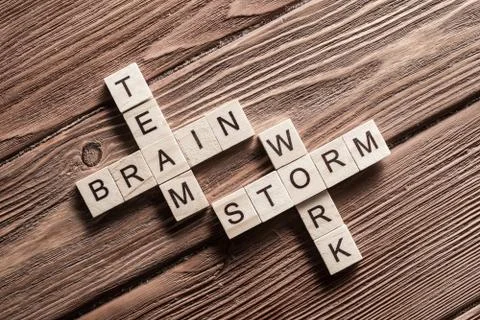 Conceptual business keywords on table with elements of game making crossword 스톡 사진