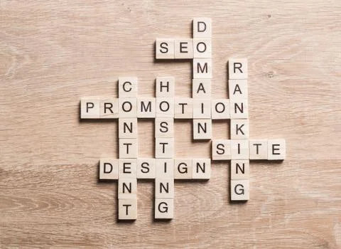 Conceptual business keywords on table with elements of game making crossword 写真素材