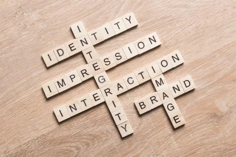 Conceptual business keywords on table with elements of game making crossword Stock Photos