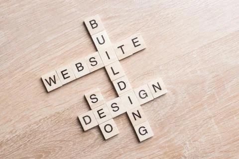 Conceptual business keywords on table with elements of game making crossword Stock Photos