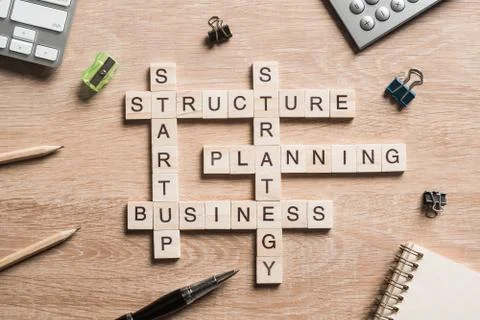Conceptual business keywords on table with elements of game making crossword 写真素材