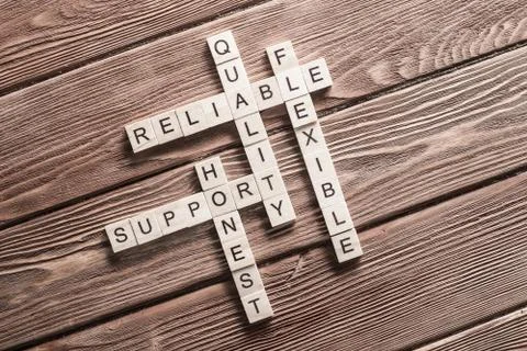 Conceptual business keywords on table with elements of game making crossword Stock Photos