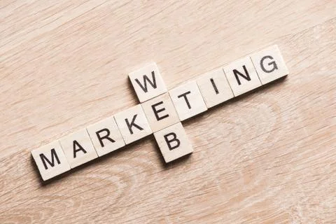 Conceptual business keywords on table with elements of game making crossword Stock Photos