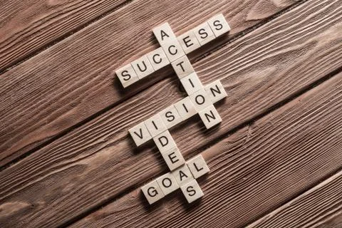 Conceptual business keywords on table with elements of game making crossword Stock Photos