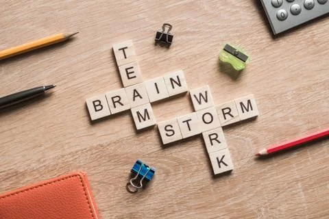 Conceptual business keywords on table with elements of game making crossword Foto stock