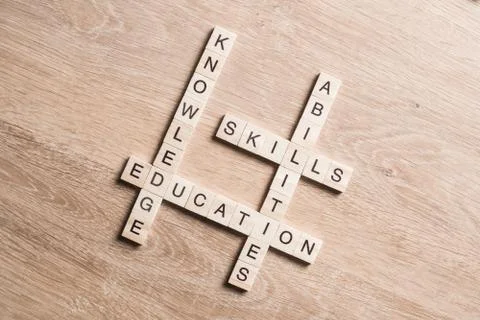 Conceptual business keywords on table with elements of game making crossword Stock Photos