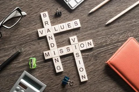 Conceptual business keywords on table with elements of game making crossword Stockfoto's