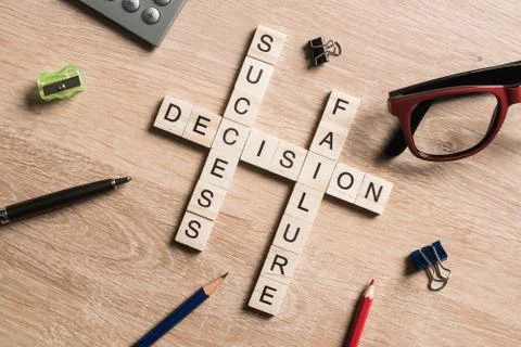 Conceptual business keywords on table with elements of game making crossword Stockfoto's