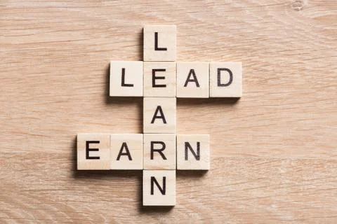 Conceptual business keywords on table with elements of game making crossword Stock Photos