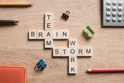 Conceptual business keywords on table with elements of game making crossword Stock Photos