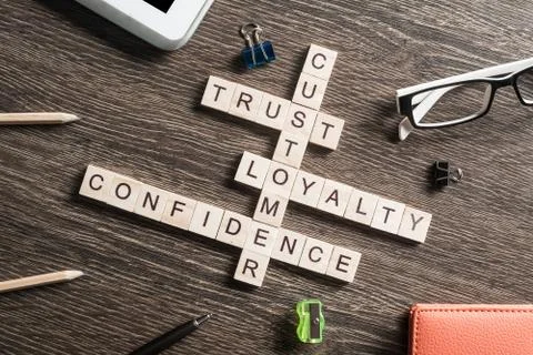 Conceptual business keywords on table with elements of game making crossword Stock Photos