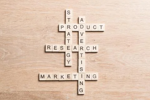 Conceptual business keywords on table with elements of game making crossword 스톡 사진