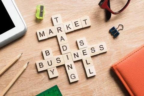 Conceptual business keywords on table with elements of game making crossword Stock Photos