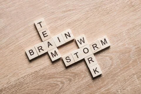 Conceptual business keywords on table with elements of game making crossword Stock Photos