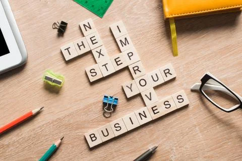 Conceptual business keywords on table with elements of game making crossword 스톡 사진