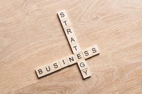 Conceptual business keywords on table with elements of game making crossword Stock Photos
