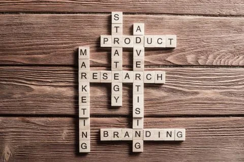 Conceptual business keywords on table with elements of game making crossword Stock Photos