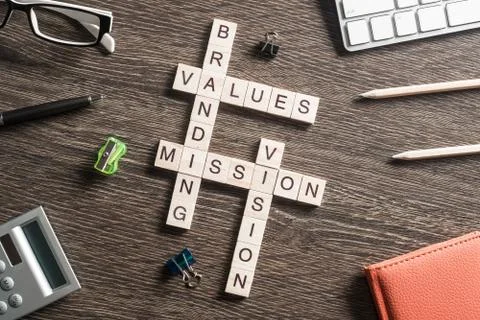 Conceptual business keywords on table with elements of game making crossword Stockfoto's