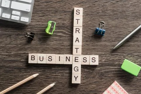 Conceptual business keywords on table with elements of game making crossword Stock Photos
