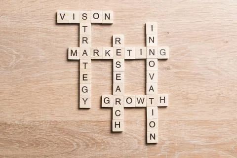 Conceptual business keywords on table with elements of game making crossword 스톡 사진