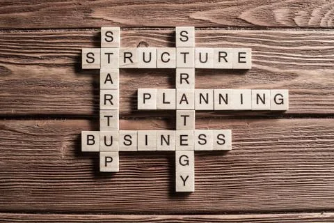 Conceptual business keywords on table with elements of game making crossword 스톡 사진
