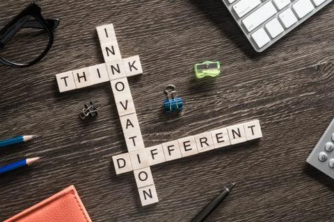 Conceptual business keywords on table with elements of game making crossword Stockfoto's