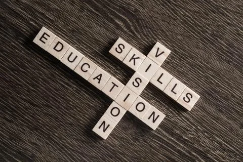Conceptual business keywords on table with elements of game making crossword Stock Photos