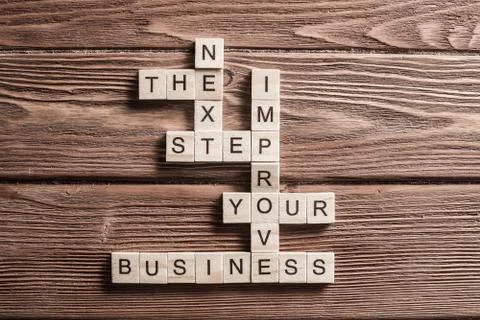 Conceptual business keywords on table with elements of game making crossword 스톡 사진