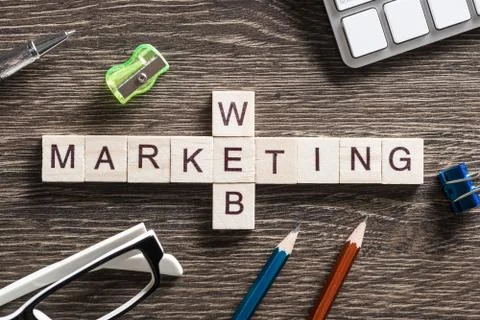 Conceptual business keywords on table with elements of game making crossword Foto stock