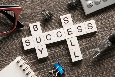 Conceptual business keywords on table with elements of game making crossword Stock Photos