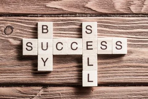 Conceptual business keywords on table with elements of game making crossword Stockfoto's