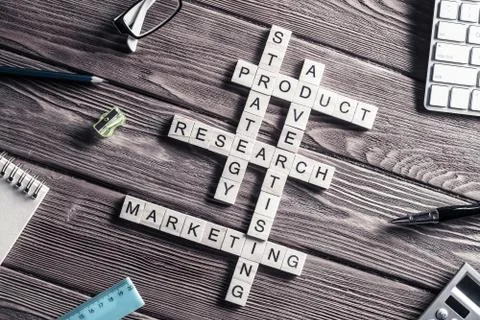 Conceptual business keywords on table with elements of game maki Stock Photos