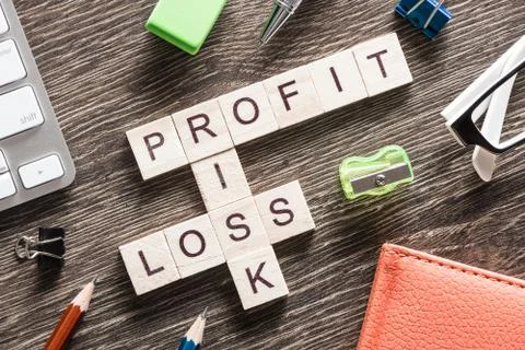 Conceptual business keywords on table with elements of game making crossword Foto stock