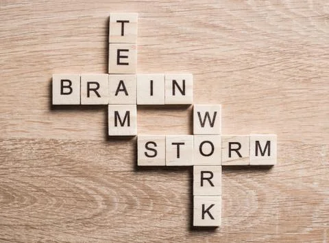 Conceptual business keywords on table with elements of game making crossword Stock Photos