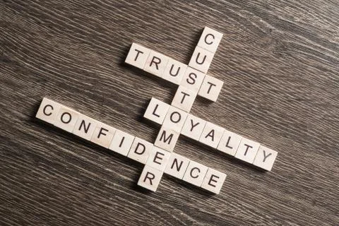 Conceptual business keywords on table with elements of game making crossword Foto stock
