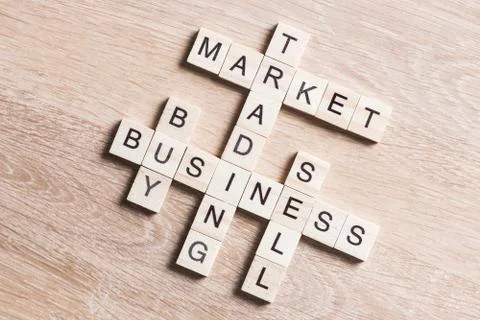 Conceptual business keywords on table with elements of game making crossword Stock Photos
