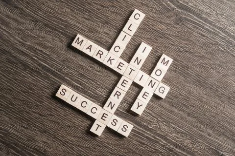 Conceptual business keywords on table with elements of game making crossword Stockfoto's