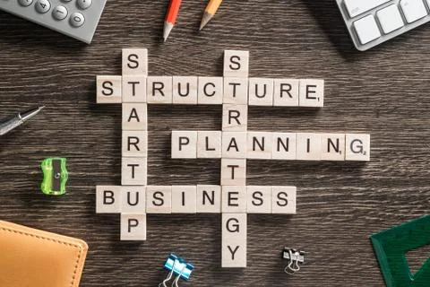 Conceptual business keywords on table with elements of game making crossword Stock Photos