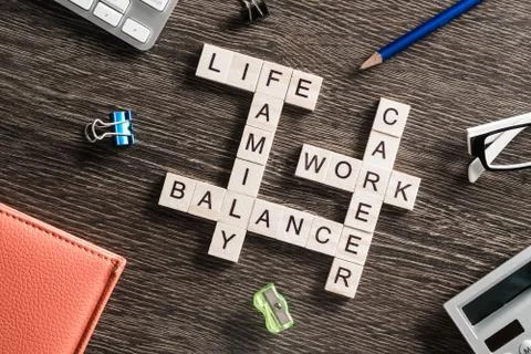 Conceptual business keywords on table with elements of game making crossword Stock Photos